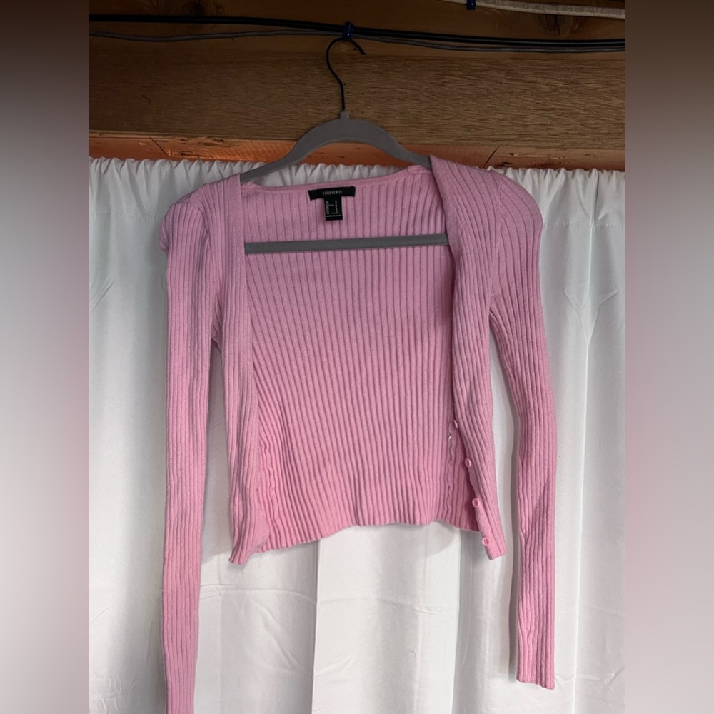 Tight fitting pink sweater